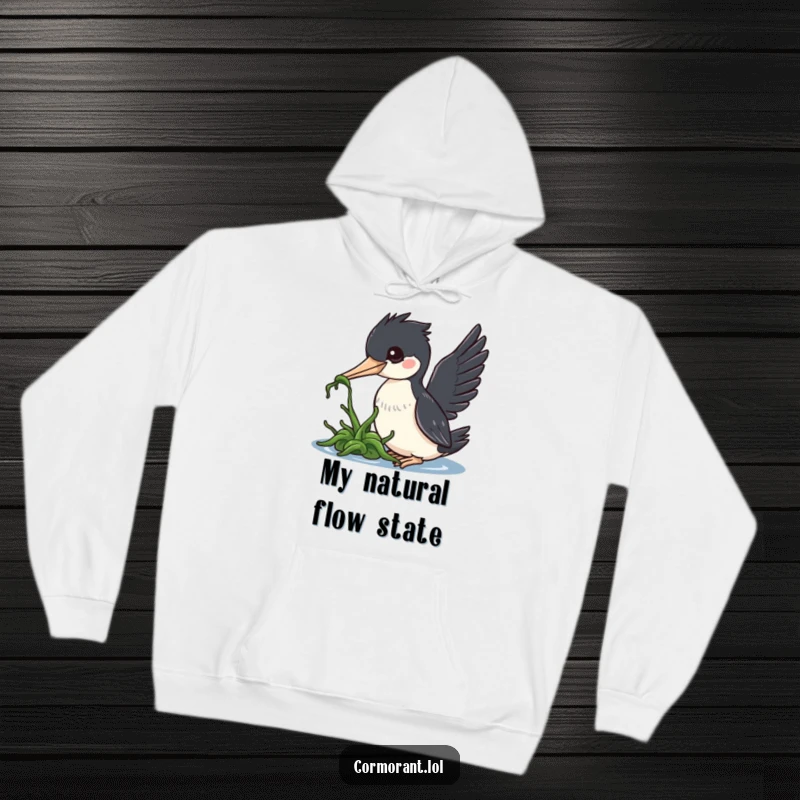 Funny cormorant hoodie, a kawaii bird using its beak to nudge floating seaweed, conveying a sweet and amusing interaction.