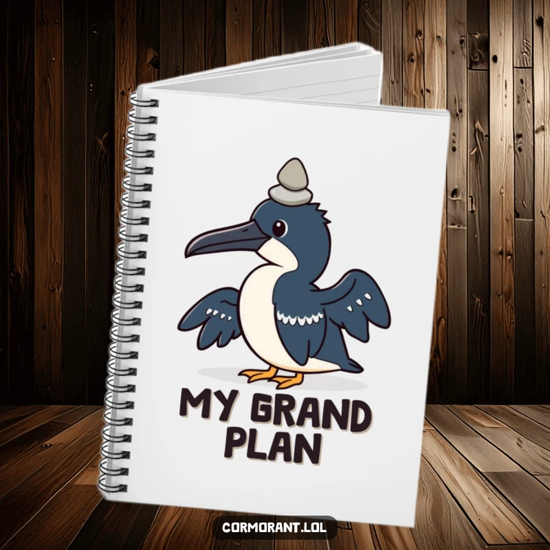 Funny notebook with a kawaii cormorant bird concentrating on balancing a small pebble on its head.