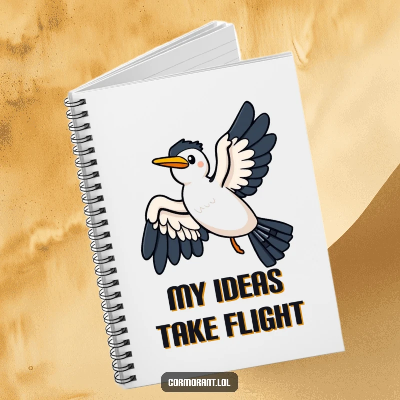 Funny notebook with a kawaii cormorant gliding on a breeze, wings spread wide, ideal for jotting down inspired thoughts.