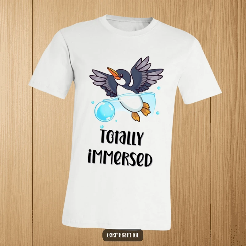 Funny cormorant t-shirt featuring a cormorant with wings spread, diving playfully into a shimmering blue bubble, perfect for beach or casual wear.